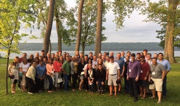 Around 35 2017 Food Executive Participants pose for group photo in front of lake