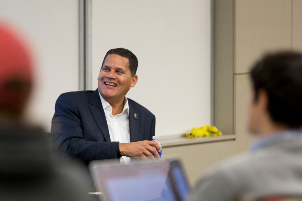 Reggie sits at the front of a classroom
