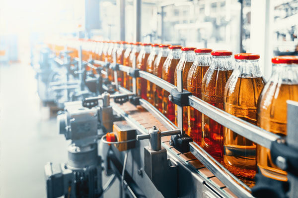 Glass bottles on a conveyor belt.