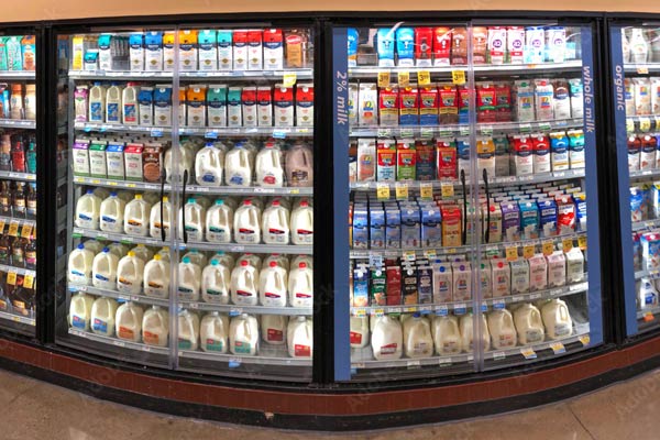 Milk in a store’s refrigerator case.