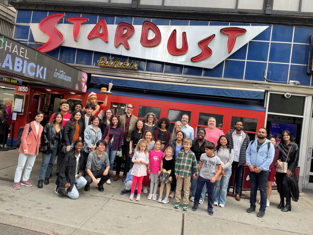 Students, faculty, staff outside Stardust Diner before seeing a Broadway show in NYC
