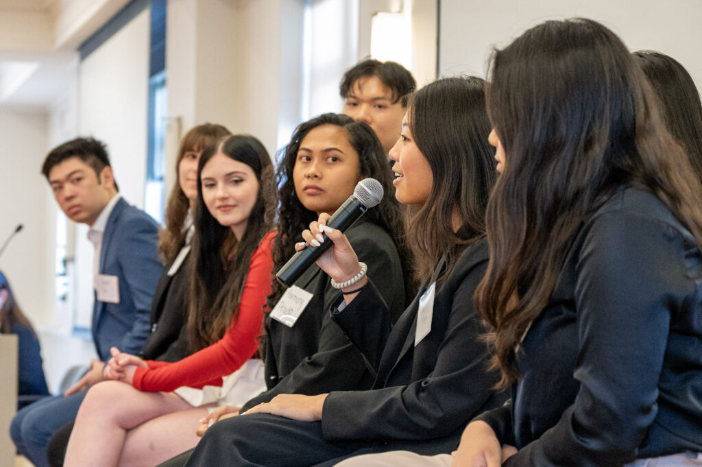 Students at a panel discussion with alumni and corporate partners
