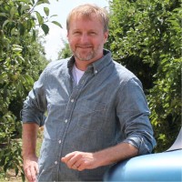 Image of Brian Nicholson in an orchard
