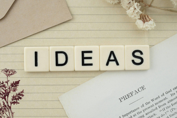 the word ideas spelled in letter tiles